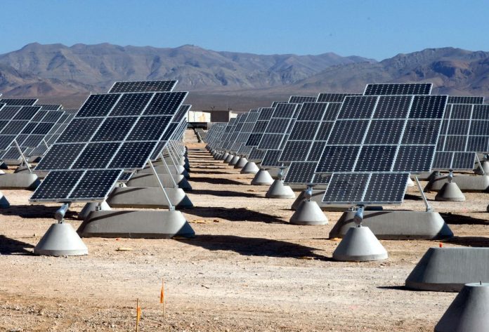 Rows of photovoltaic panels at a large utility-scale solar farm