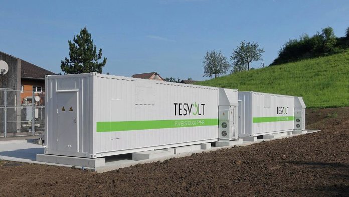GM's $108 Million Sodium-Ion Battery Bet Targets AI Data Center Power Row of battery energy storage system containers at a grid storage installation