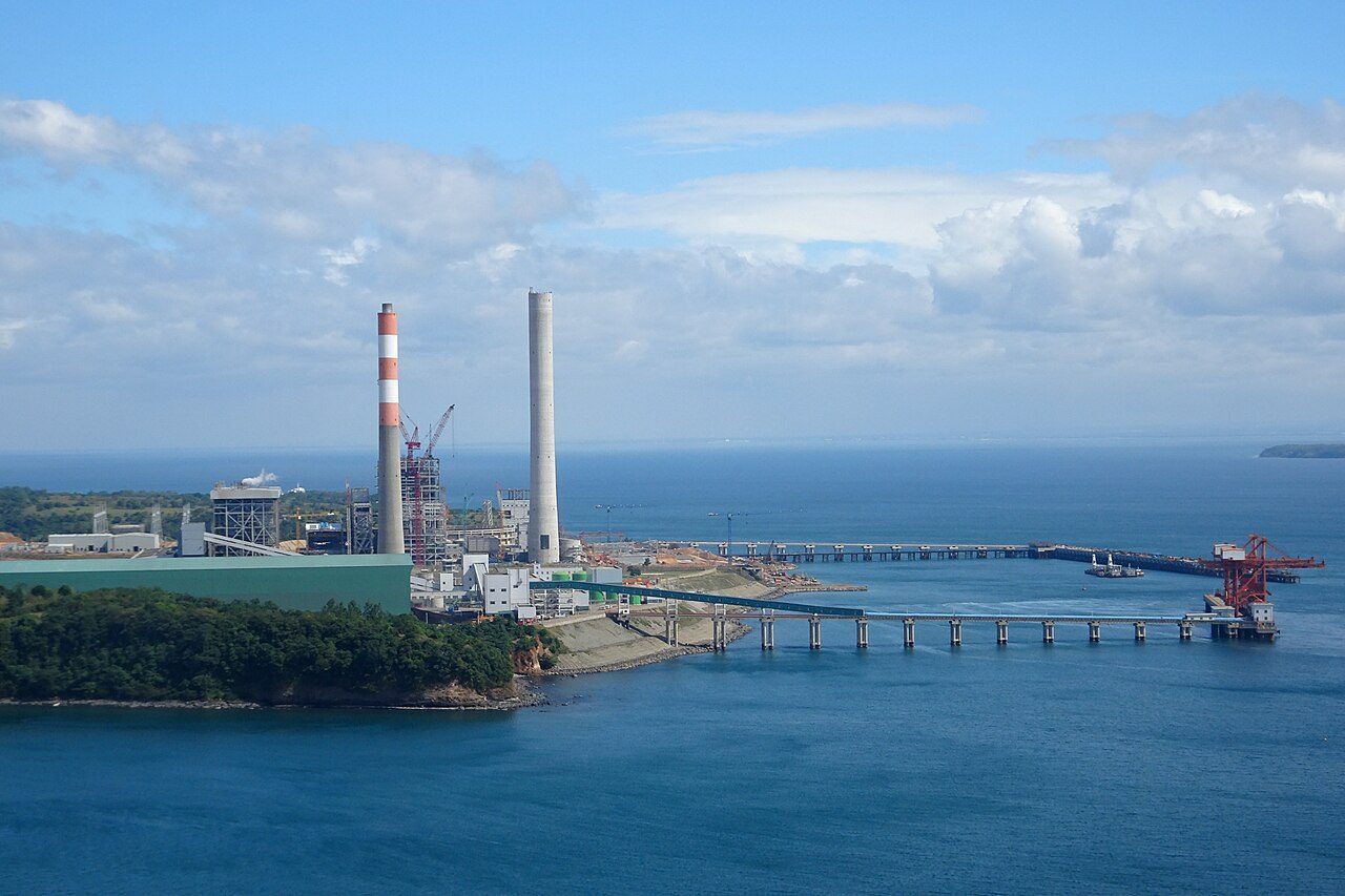 Coal-fired power plant with smokestacks
