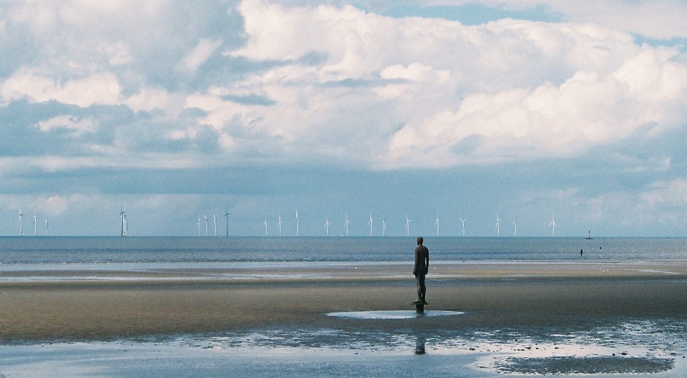 Aerial view of offshore wind turbines in the sea