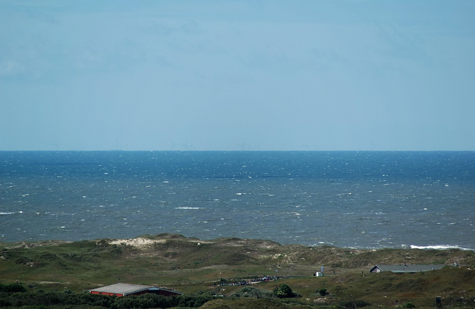 The alpha ventus offshore wind farm on the horizon off Lower Saxony, seen from the Norderney lighthouse