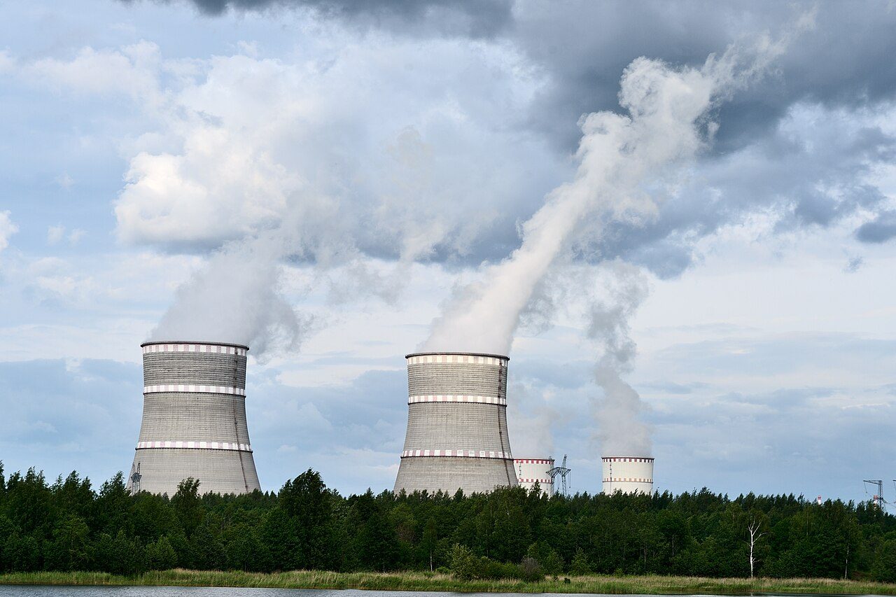 Cooling towers of a nuclear power station releasing vapour into the sky.