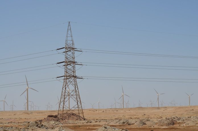 Shadwan Wind Farm Egypt: Scatec Breaks Ground on 900 MW Project Wind turbines under construction on a desert coastal plain in Egypt