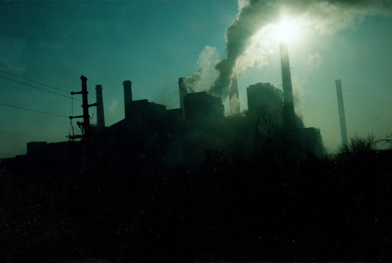 Factory smokestack emitting smoke