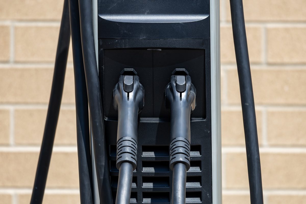 Close-up of two electric-vehicle charging handles on a public ChargePoint station.