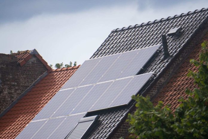 Qcells US-Made Solar Frames: How 4 GW of Tennessee Aluminum Unlocks the 10% Bonus Before the 55% Rule Hits in 2027 Solar panels installed on a residential rooftop in bright daylight