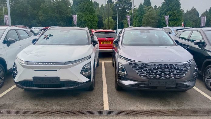 Omoda 5 and E5 electric models on display at the Omoda Jaecoo dealership in Coventry, England — Chery's UK showroom brands